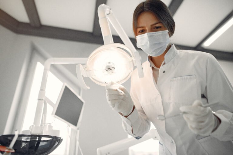 Beautiful dentist working on a dental clinic Beautiful dentist working on a dental clinic